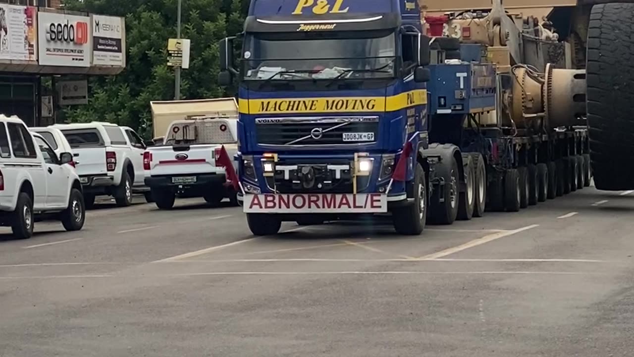 Mining Trucks Stop Traffic