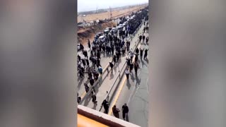 Crowds march to Mahsa Amini burial site in Iran