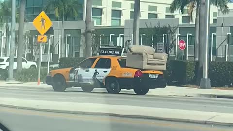 Taxicab Hauls Couch