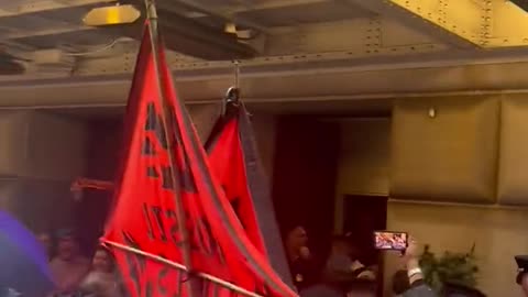 Climate change activists blocking entrances of the Federal Reserve in downtown Manhattan