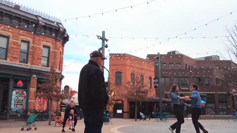 Latin Dancing to Street Busking Sax player