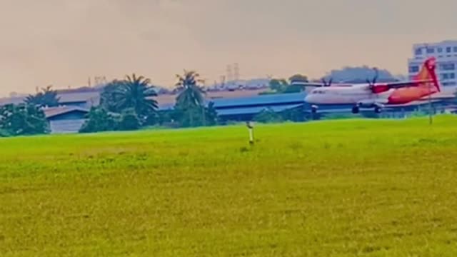 M landing aeroplane at airport