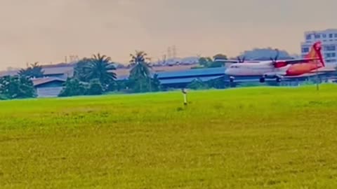 M landing aeroplane at airport