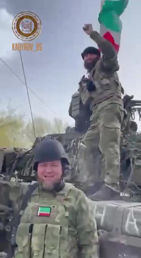 Ukraine War - Fighters from the Chechen Republic are hoisting a flag