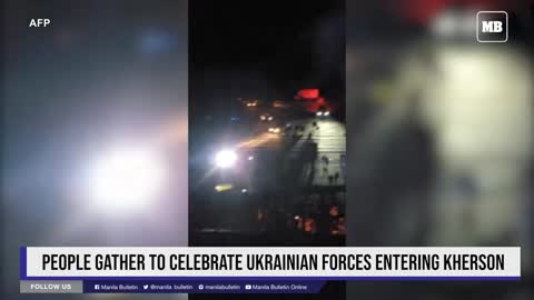 People gather to celebrate Ukrainian forces entering Kherson