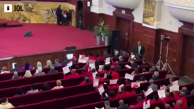 Watch: EFF holding up placards during MTBPS