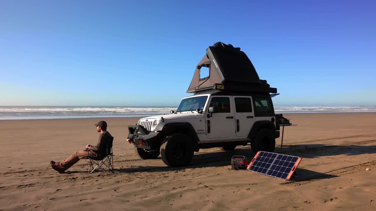 A person camping by the sea, with the beauty of nature nearby