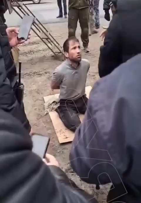 One of the Moscow Shooters being interrogated