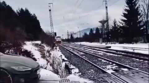 Tesla pulling out in front of a train