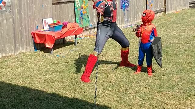 Houston superhero party character iron spider pose with web line in Pearland Texas at birthday