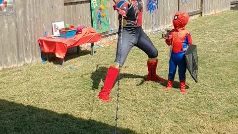 Houston superhero party character iron spider pose with web line in Pearland Texas at birthday