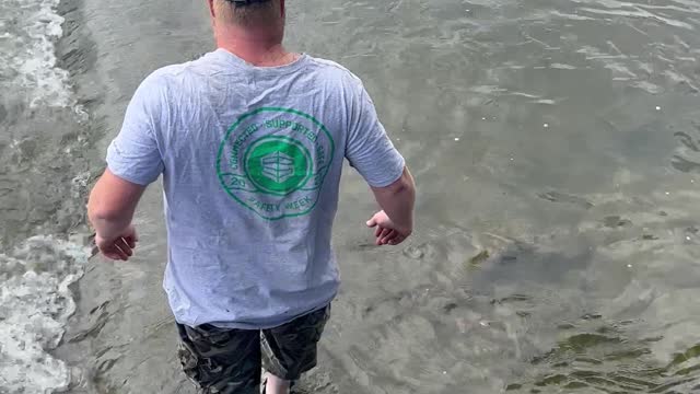 Man Catches Massive Sturgeon with Bare Hands