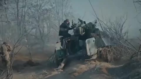 Ukrainian soldiers using a T-12 anti-tank gun mounted on an MT-LB