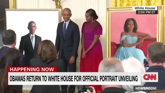 Barack Obama gives a speech after the unveiling of his White House portrait