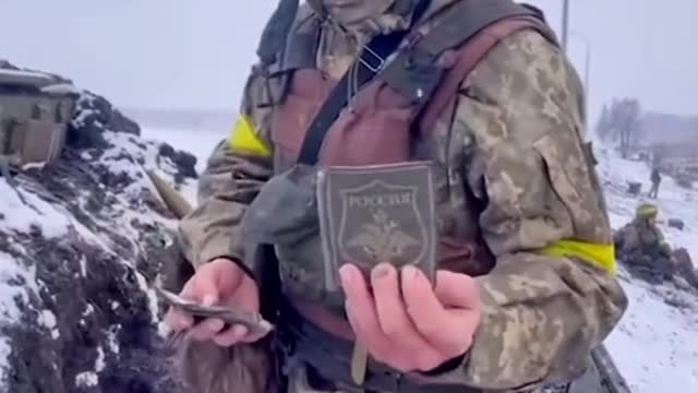 Ukranian shows of patches hes taken from russian soldiers