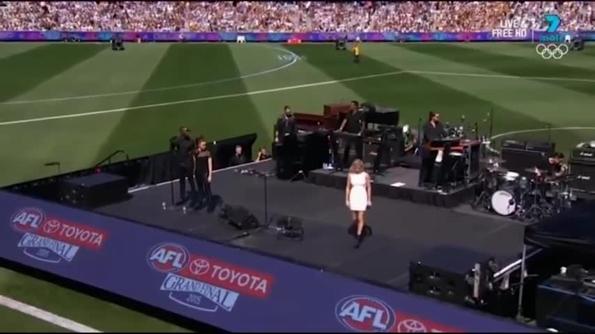 Lip-syncing? Ellie Goulding performs at the AFL Grand Final