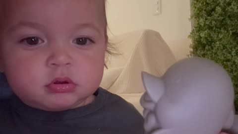 Baby Imitates Dolphin's Beak