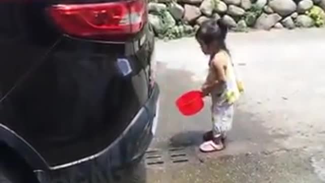 Baby cleaning car. So cute