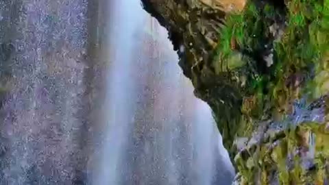 Waterfall down in mountains