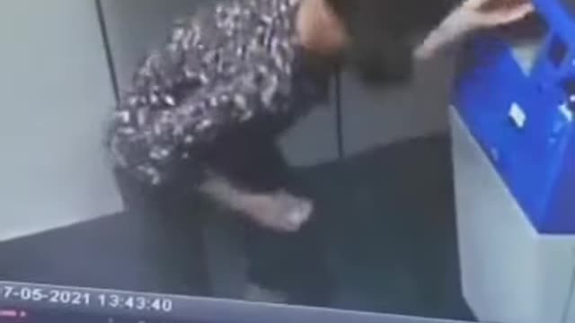 Girl Dancing inside the ATM booth