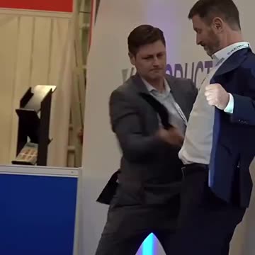 CEO demonstrates stab proof shirt