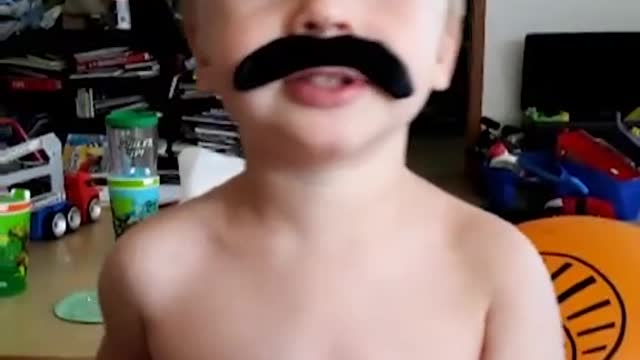 He's rockin' the stache! Git it, little man! 🥰