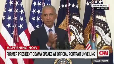 Barack Obama gives a speech after the unveiling of his White House portrait