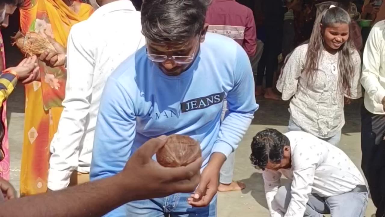 Breaking Coconut in front of Godess BhadraKali Mata Temple