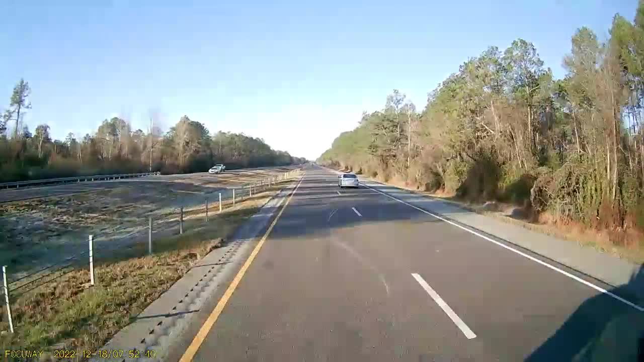 Car backing up in the slow lane