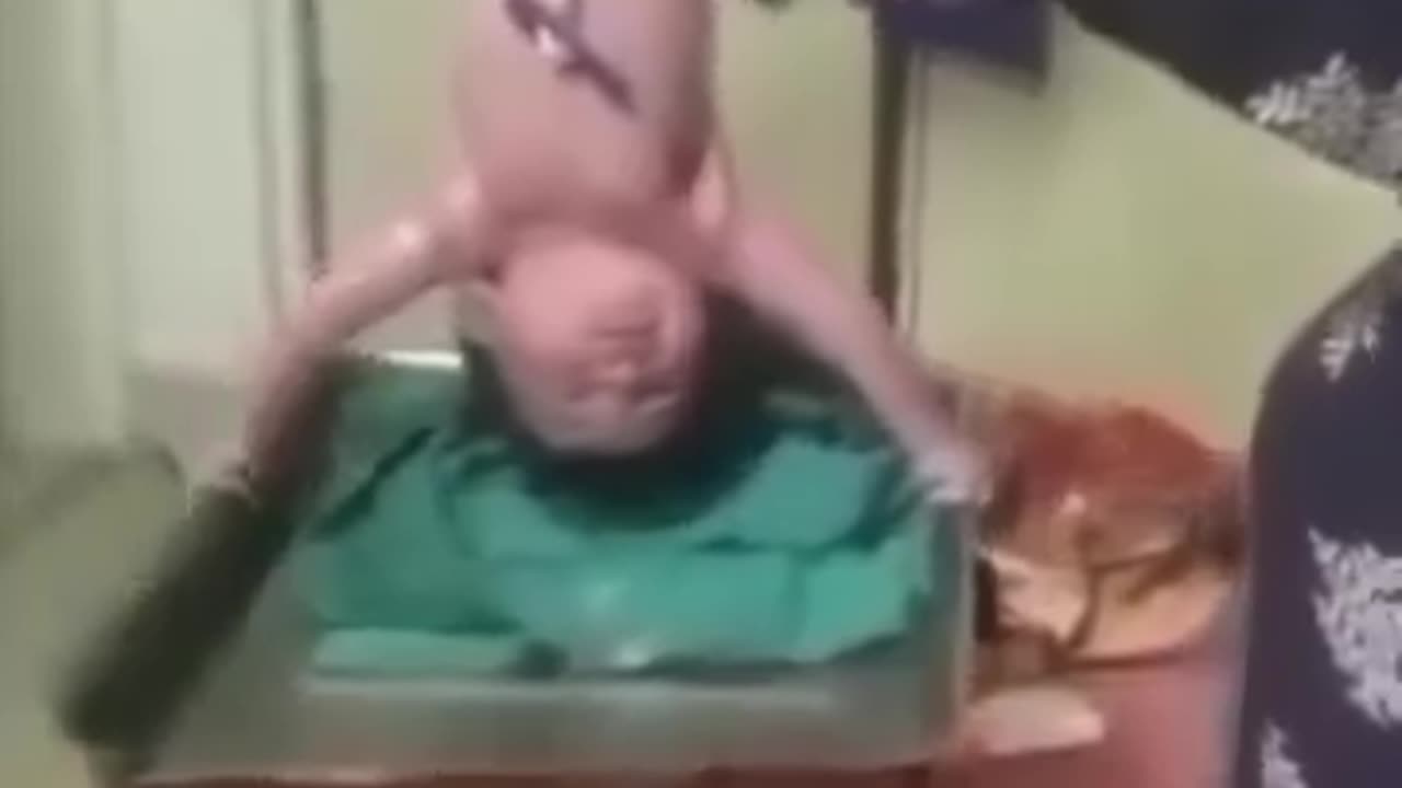 New baby holding watch it