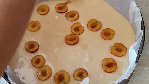 Decorating pie with fruits