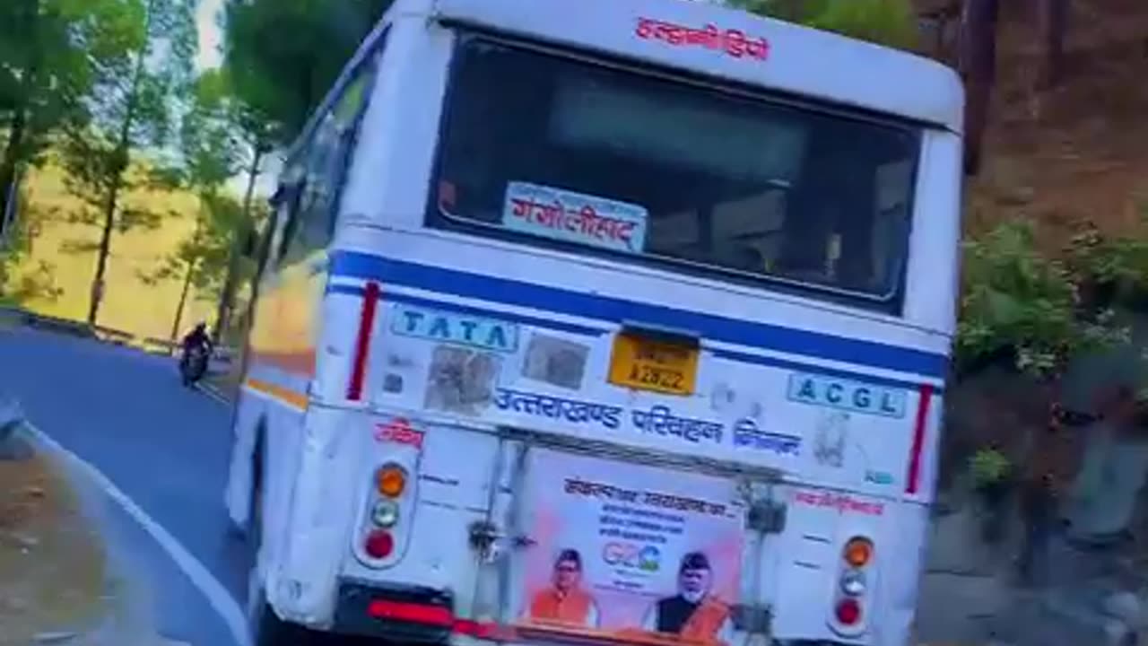 Heavy driver driving bus at full speed on mountains.