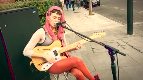 Guitar Street Performers Gabriela Eva Playing Live Music