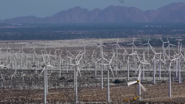 This is what it takes to make an electric car, solar panels and windmills