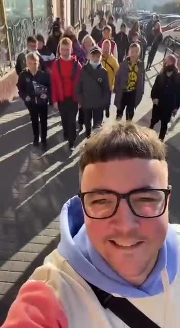 Ukrainian children singing a Nazi WW2 song in the middle of the street.