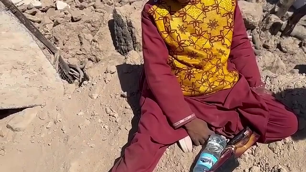 His mom and dad died on an earthquake in herat..the rocks that he is sitting in rests his family.