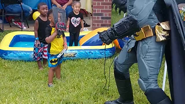 Houston superhero party character batman uses the batshield & batarang at a birthday in Humble, TX.