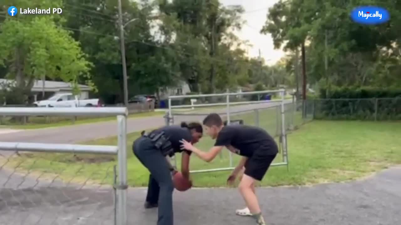 Female police officer schools local teen in game of one on one basketball