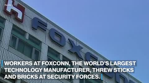 Workers clash with police at Foxconn factory in China l ABC News