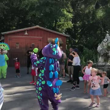 Chip and Dale dressed like Dinosaurs