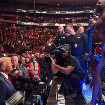 UFC fighter Jon Jones presents his belt to President-elect Donald Trump after winning his fight