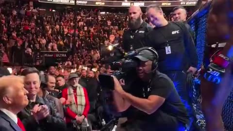 UFC fighter Jon Jones presents his belt to President-elect Donald Trump after winning his fight