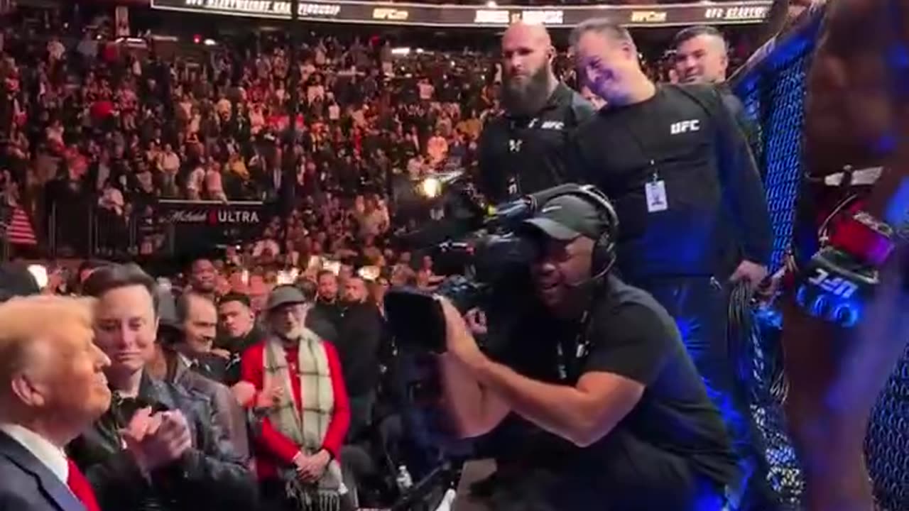 UFC fighter Jon Jones presents his belt to President-elect Donald Trump after winning his fight