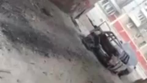 Ukraine War - Chechen soldiers are pulling out a wounded comrade