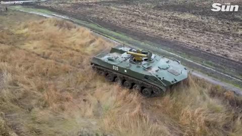 Mobilised Russian troops train using tanks and missile systems