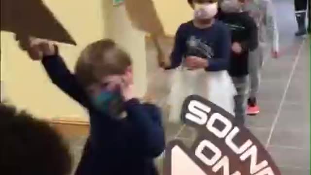 Toddlers in DC forced to walk around with masks on chanting "black lives matter"