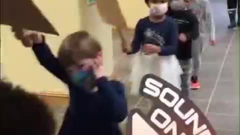 Toddlers in DC forced to walk around with masks on chanting "black lives matter"