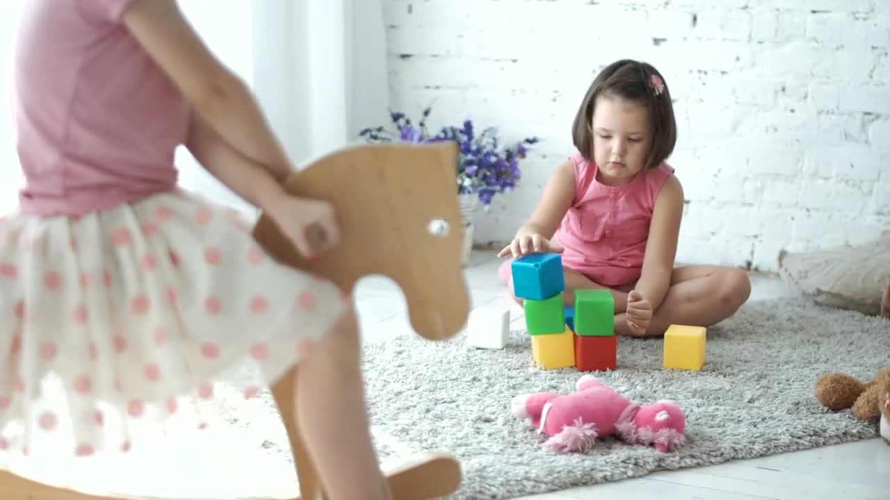 Little girls playing in the toy room