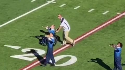 Band director helps a student in a wheelchair perform. Touching! 👨‍🦼❤️