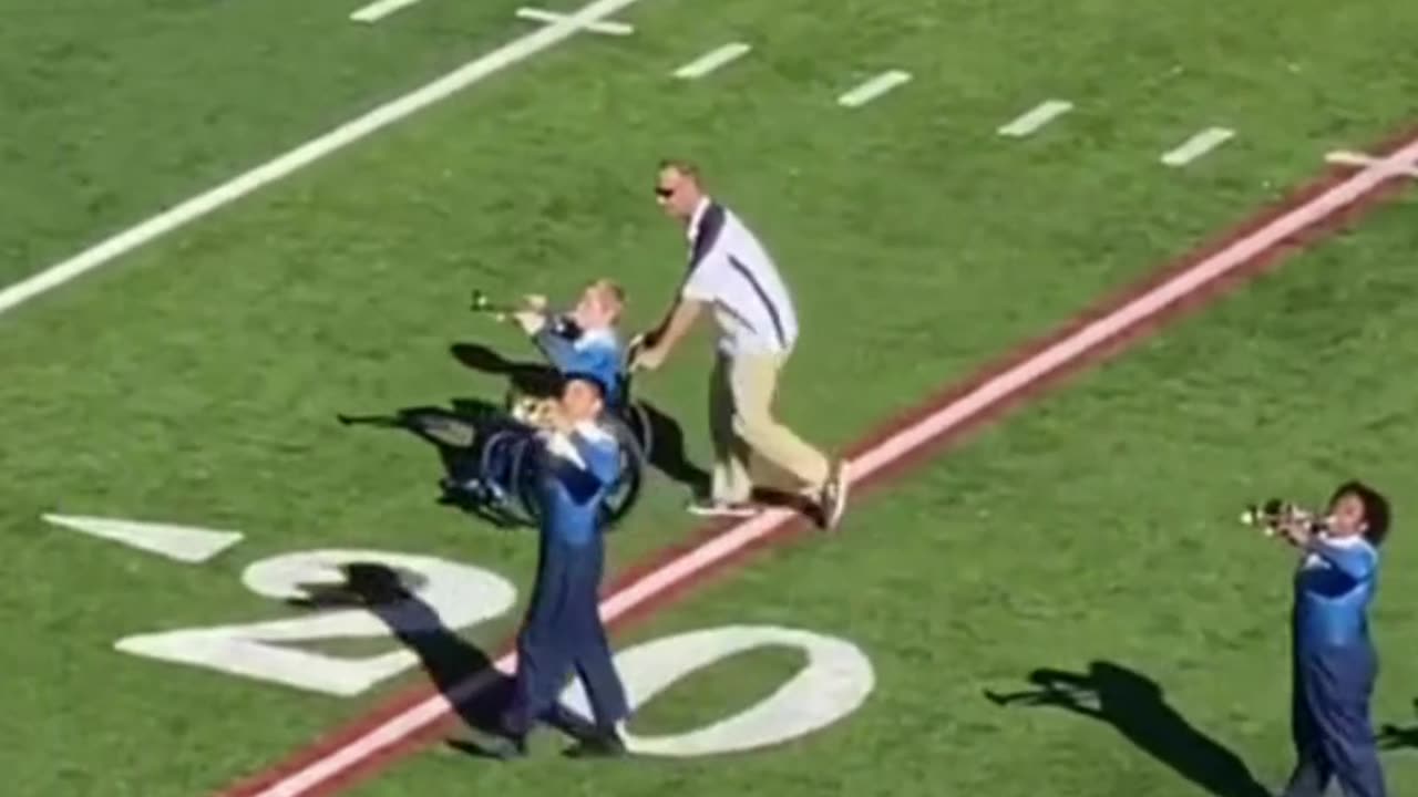 Band director helps a student in a wheelchair perform. Touching! 👨‍🦼❤️